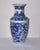 An elegant vase showing a powerful dragon hovering around the magical pearl An elegant porcelain Chinese Export bottle...