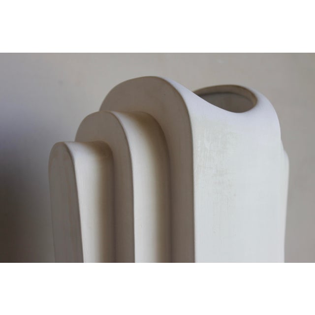 Monumental and stunning decorative piece! Unglazed bisque has an earthy, raw quality while the Machine Age design of the...