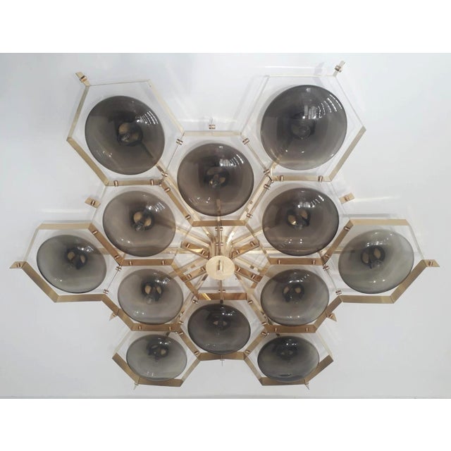 Italian midcentury flush mount with twelve smoky Murano glass shades mounted on solid brass frame in lacquered polished...
