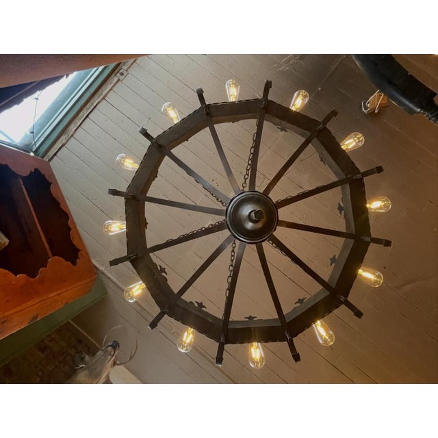 Massive vintage gothic-revival/lodge style 12-light chandelier. All metal/welded construction. Completely rewired, all...