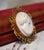 Antique 14K Conch Shell Cameo with Seed Pearls Brooch and Pendant This lovely antique cameo is carved from a Conch shell....