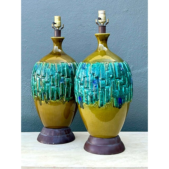 This exceptional pair of Mid-Century Modern table lamps showcases a bold, organic aesthetic reminiscent of the iconic...