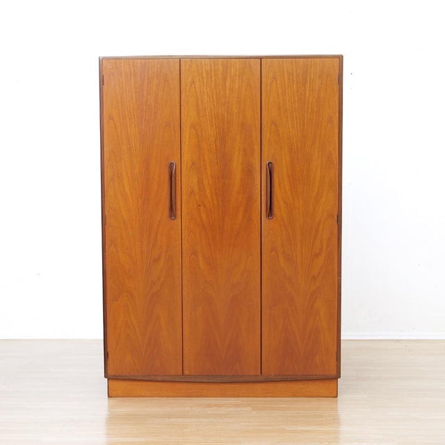 This handsome mid-century triple wardrobe by G Plan showcases the clean lines and exceptional craftsmanship that made...
