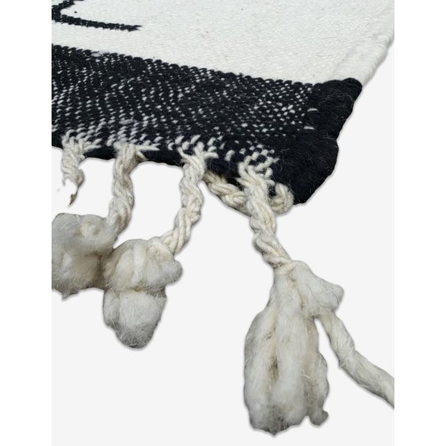 Boujad Rug | Handwoven Berber Flatwoven Rug with Bold Black Stepped Motif This dramatic Boujad rug features a bold,...