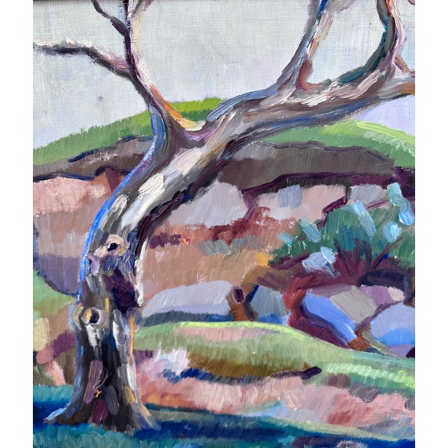 Post-impressionist colorful landscape oil painting on hardboard with two twisted leafless trees against a low hill. Signed...