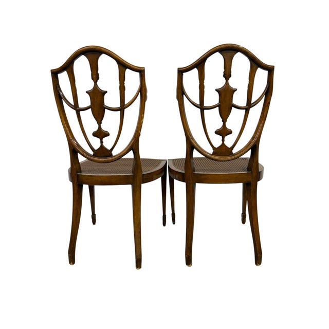 This is a wonderful pair of English Hepplewhite side chairs, dating to the 19th century. They are hand-painted and have...