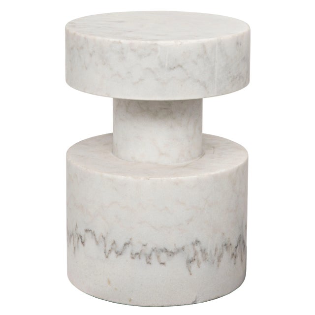 Hand-carved from marble, this imposing accent table makes an opulent and stylish addition to a contemporary decor. No two...