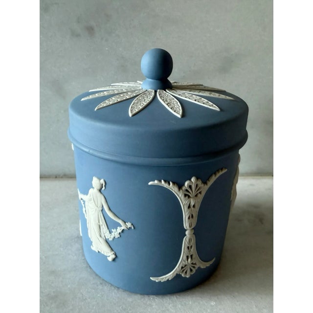 Vintage Wedgwood Jasperware vanity jar or lidded pot, in the "Dancing Hours" pattern. Jasperware is a type of unglazed...