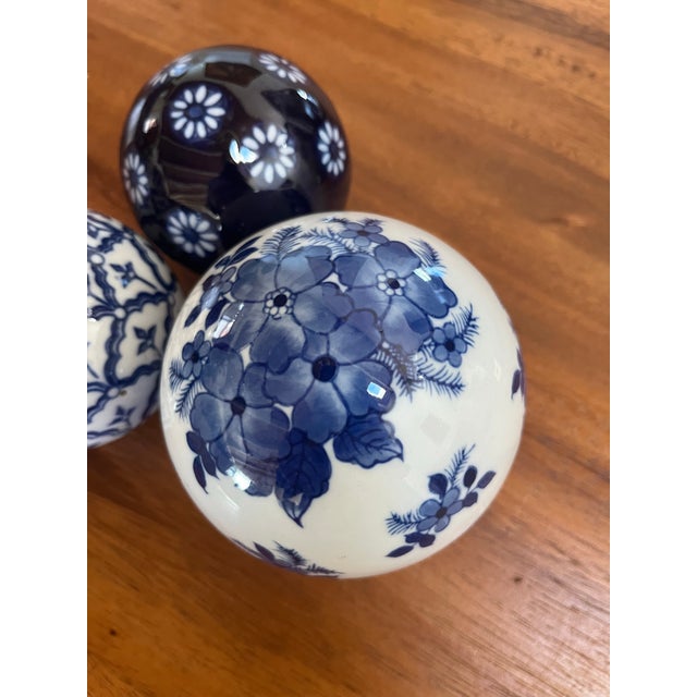 Blue and white assorted design porcelain bowls set including: Two smaller balls:3” d One larger ball: 5” d Use them to...