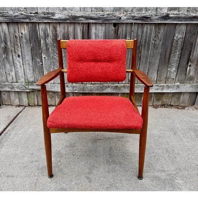 Jens Risom model C-160 walnut armchair c. 1957. Solid walnut frame with beautiful wood grain. Nubby orange/red upholstery...