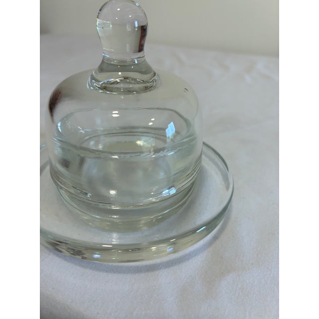 Classic vintage clear glass butter dish complete with domed lid and knob finial. Simple, elegant pressed glass style that...