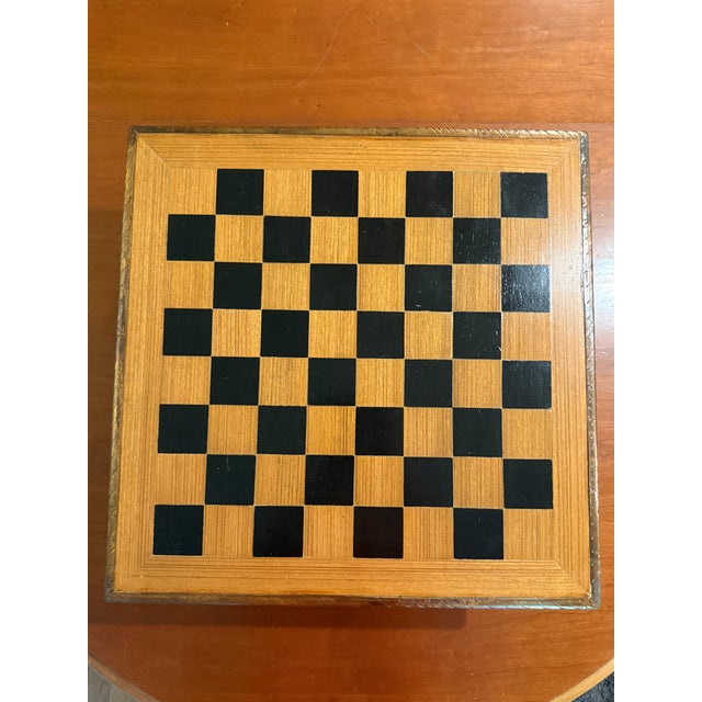 The board is nicely carved with Rajasthani designs at the rim, the sides and feet are covered with clad silver metal...
