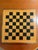The board is nicely carved with Rajasthani designs at the rim, the sides and feet are covered with clad silver metal...