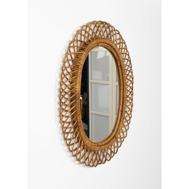 Midcentury amazing oval wall mirror in rattan and bamboo by Franco Albini. Made in Italy in the 1960s. This piece is...