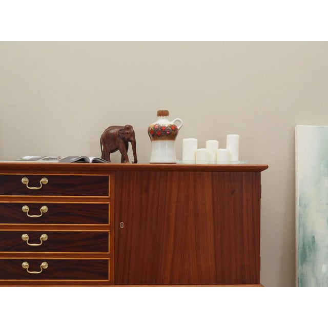 The jug was made in the 1970s, produced by the German Strehl manufactory. It is made of ceramic in white, brown and red....