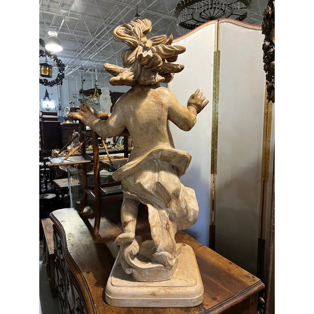 A 19th Century continental carved wooden putti. The Italian word putti refers to winged angel children, or more rarely boy...