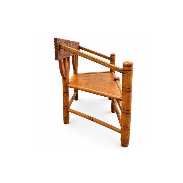This exceptional antique oak bench featuring extensive hand-carved geometric decoration and substantial handcrafted...