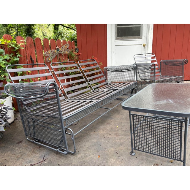 For your consideration, a beautiful glider by Russell Woodard iron with vinyl strap seating and curved iron mesh, arms...