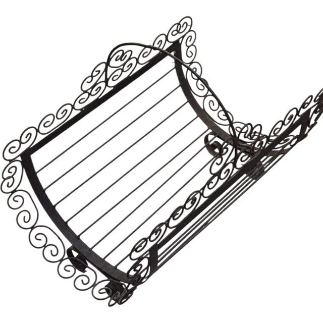 A gorgeous Firewood Log Holder. It’s gorgeous. Crafted from black IRON it features curled metal rods along the edges and...