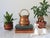 Vintage hand forged copper pot or small cauldron featuring a curved brass swing handle with etching detail. No makers...