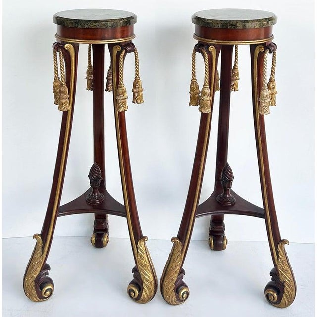 Mahogany Giltwood Pedestals with Carved Tassels & Tesselated Stone Tops, a Pair Offered for sale is a pair of mahogany and...