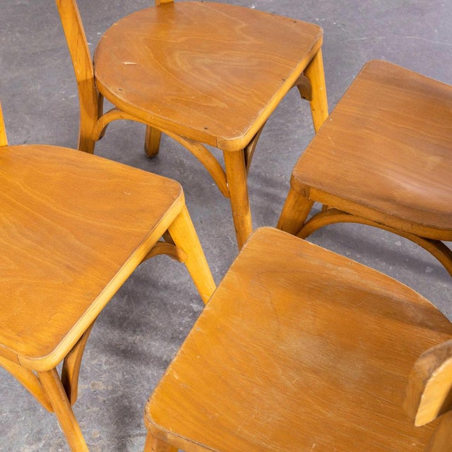 1950’s French Baumann Blonde Beech Bentwood Dining Chairs – Set Of Four. Baumann is a slightly off the radar French...