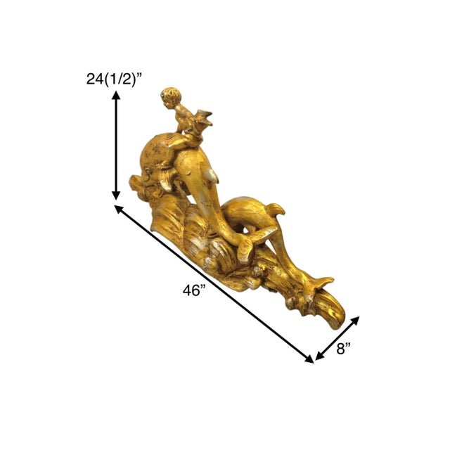 Large golden cherub riding a dolphin in Paul Manship style. Whimsical Mid-Century statement sculpture. Condition: The...
