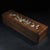 This is a beautifully crafted rectangular wooden box featuring a sliding lid adorned with intricate mother-of-pearl...
