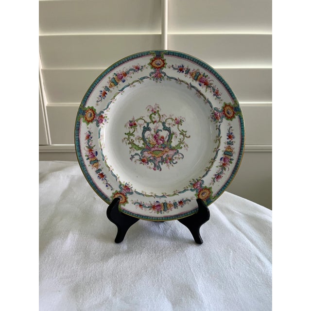 Cauldon luncheon plate with a floral pattern and aqua border. Made in England. Has a diameter of 7.75”. Used, but in very...