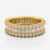 A dramatic interpretation of the eternity band, this 14K Yellow Gold ring combines natural diamonds in a continuous...