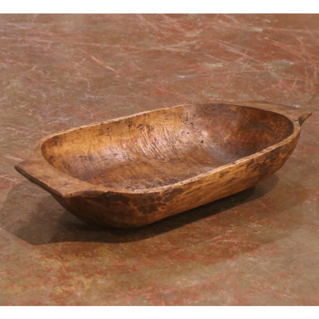This authentic antique French dough bowl was hand-carved from a single solid block of elm circa 1880 and reflects the...