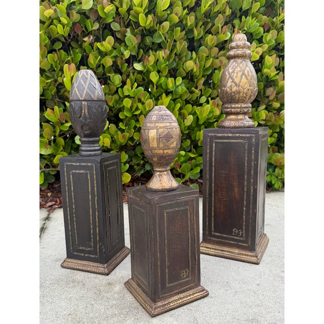 Striking set of three vintage hand-carved wood obelisks, each individually constructed and signed D.J. The graduated forms...