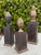 Striking set of three vintage hand-carved wood obelisks, each individually constructed and signed D.J. The graduated forms...