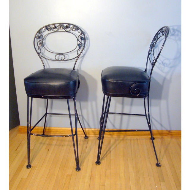 A rare pair of Woodard wrought iron bar stools in the desirable Chantilly Rose Pattern. They have been painted and some of...