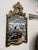 A large exquisite chinoiserie mirror in ebonized black lacquer with intricate hand painted gold gilt motifs, cascading...