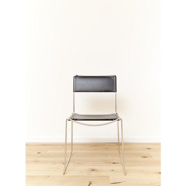 Italian industrial designer Giandomenico Belotti designed this postmodern stacking chair in the early 1980s. The frame is...