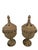 A pair of terracotta orangerie stoves, Italy, 19th century. Each stands on a round foot and a turned stem. The body...