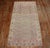 a Pink and celadon Green Gallery size Khotan, circa 1930 Details rug no. j2103 size 5' 1" x 10' 4" (155 x 315 cm)