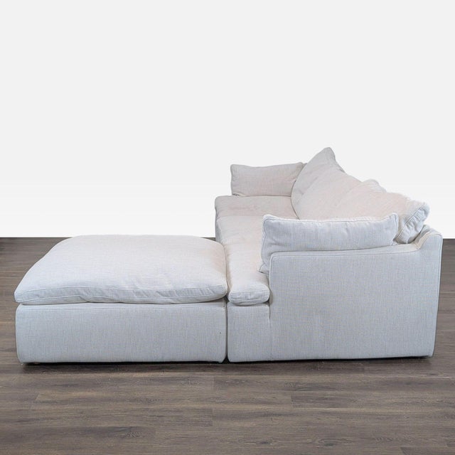 This Restoration Hardware sectional features a modern design with a spacious chaise lounge. Upholstered in fabric, it...