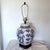 Large-scale blue and white Chinoiserie table lamp with dragon motif. It is a converted ginger jar. It measures 29" tall x...