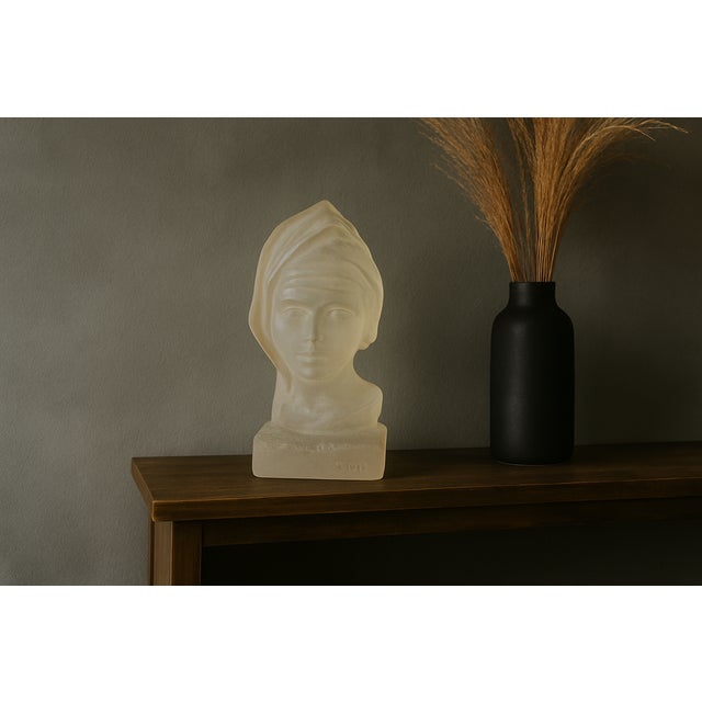 A striking mid-century translucent lucite (acrylic) bust sculpture of a woman, signed © CD and dated 1978 in the casting....