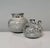 An impressive set of two studio ceramic art vessels including a vase and a jug, created by the renown ceramist duo Elli...