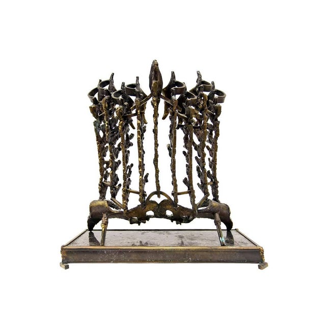 In this Menorah Chaim Hendin takes a personal approach, and turns it into a more anatomical, almost pelvic, looking piece...