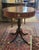 Fine 1940s mahogany empire style drum table. Features well detailed brass lion paw feet, round circular brass pulls with...