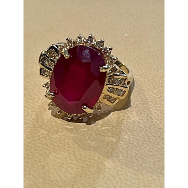 Oval 12 Carat Treated Ruby and 1 Carat Diamond 14 Karat Yellow Gold Ring For Sale - Image 11 of 18