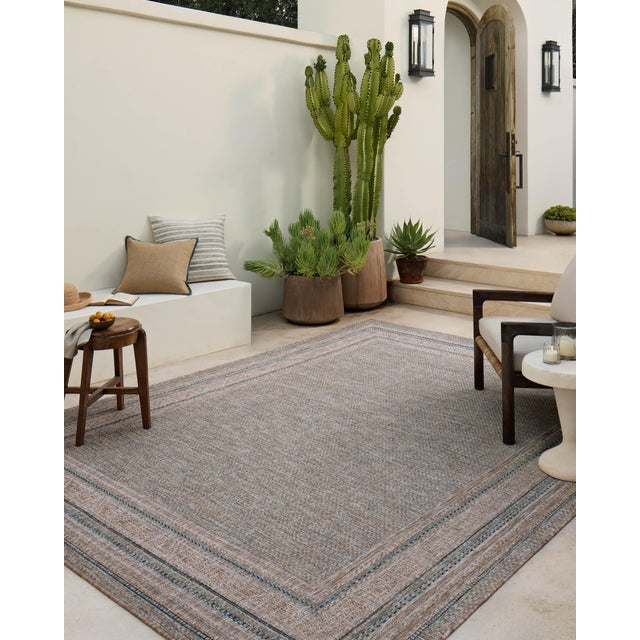 Inspired by the scenic mountain town in California, the Topanga Collection is an indoor/outdoor rug made of durable...