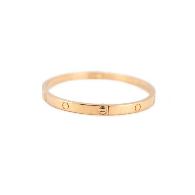 Brand: Cartier Gender: Ladies Metal Type: 18K Yellow Gold Length: 6.25 inches Width: 3.60 mm Weight: 17.71 grams CARTIER...