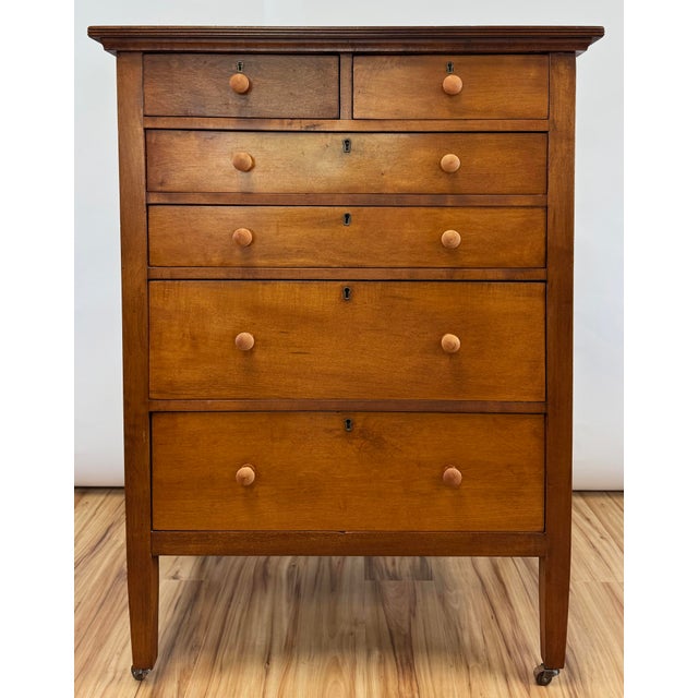 Classic vintage pine tallboy dresser in warm original patina on castors. Wood knobs. The versatile size makes this a good...