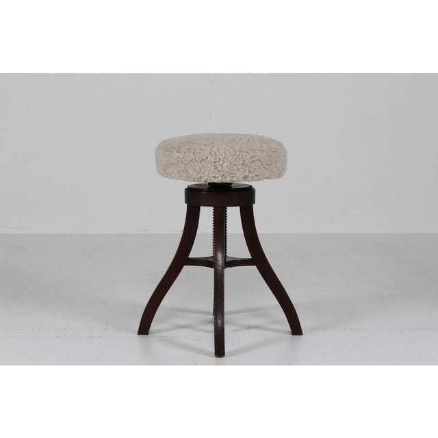 Danish tripod height adjustable bar stool/desk stool/swivel stool made of solid dark stained wood with round seat...