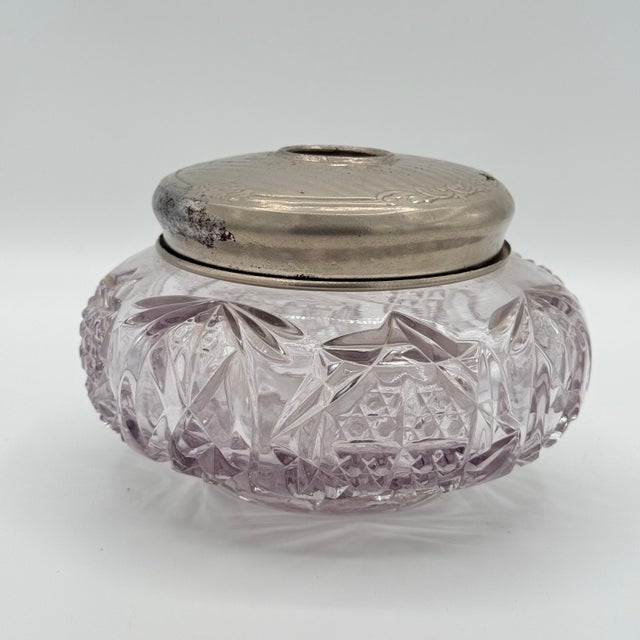 A beautiful early 20th-century cut crystal hair receiver, the kind of elegant grooming accessory that once lived on well-...